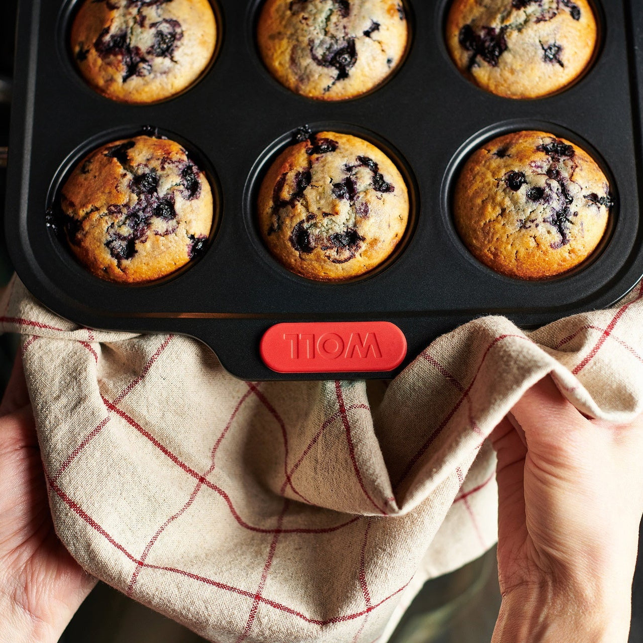 Blueberry muffins fresh from the oven in a Woll Let's Bake! 12-cup muffin pan