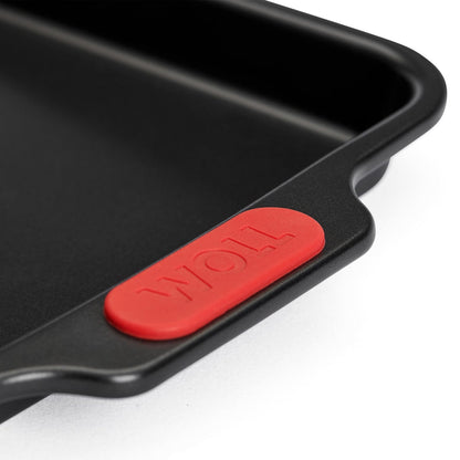 Close-up detail of Woll baking sheet silicone grip and non-stick edge