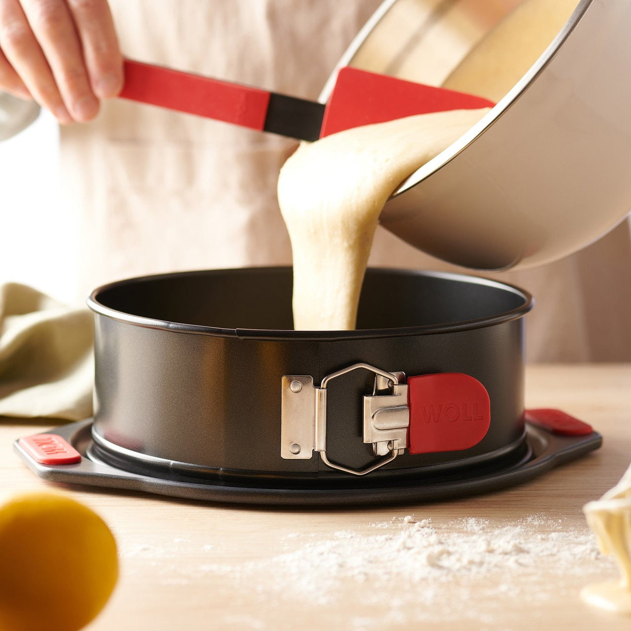 Sponge cake batter poured into a Woll Let's Bake! springform pan